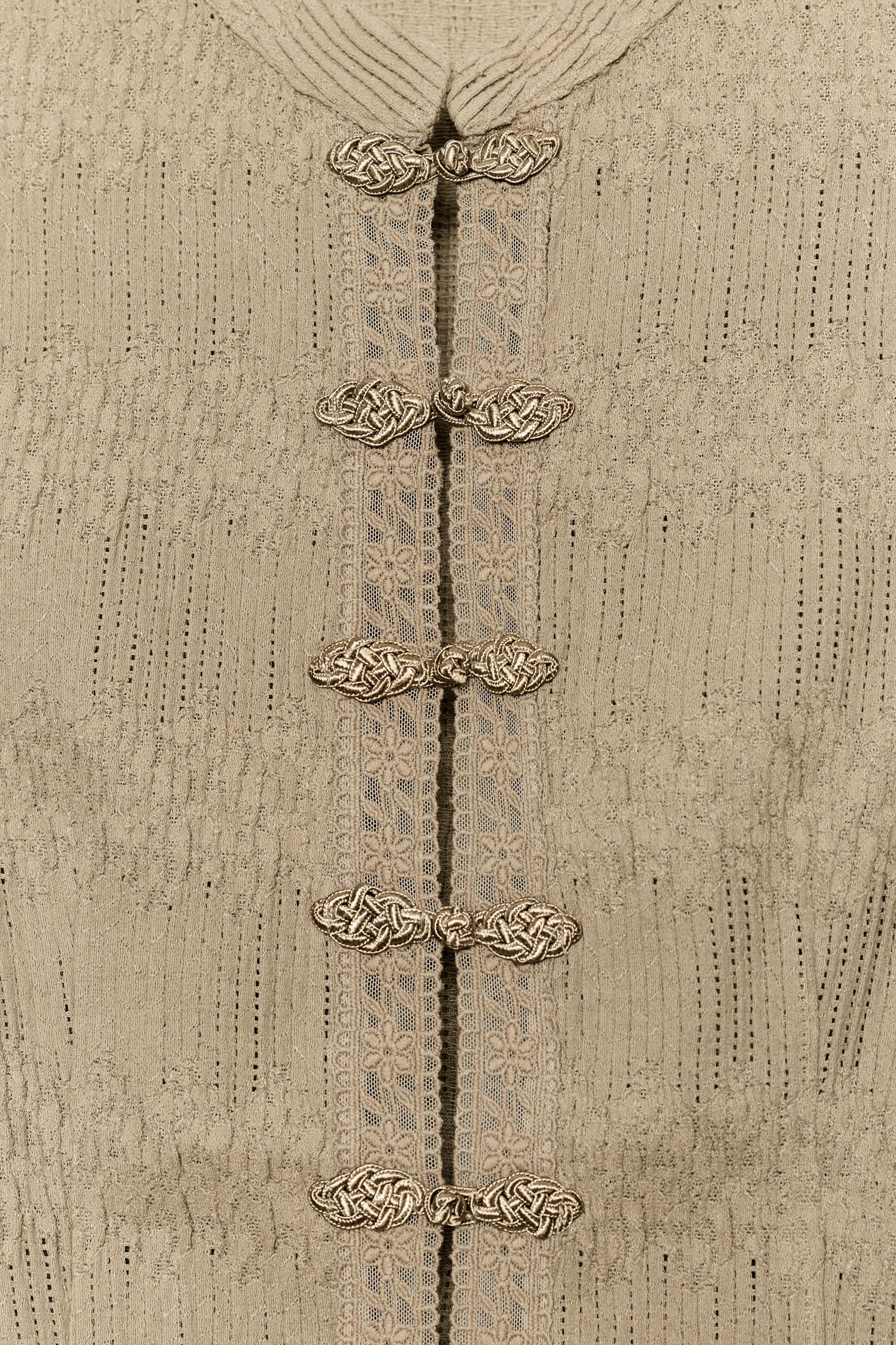 PLEATED VEST WITH FROG FASTENING